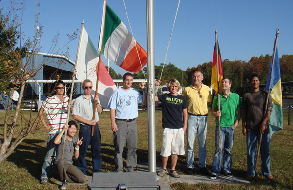 International flight students celebrating pilot certificate