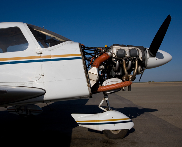 Certified aircraft mechanic inspecting aircraft